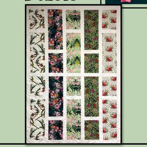 May include: A floral quilt with the word "Dulcie" at the top. The quilt features various floral patterns in shades of pink, green, and white. The quilt is framed by a green border and a pink rose.
