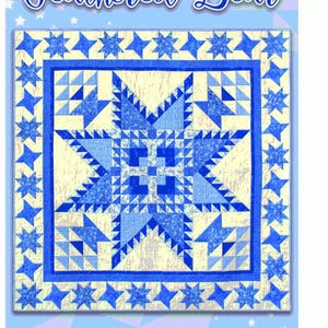 May include: A quilt pattern called "Feathered Bear" by Kris Holderness. The pattern features a blue and white star design with a yellow background. The pattern is surrounded by a border of blue stars.