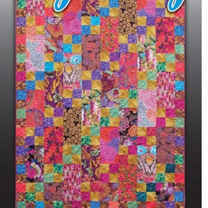 May include: A colorful quilt pattern called "Big Bang" designed by Minay Sirois. The quilt is made up of squares of different fabrics in a variety of colors, including red, pink, purple, blue, green, yellow, and brown. The quilt is a checkerboard pattern, with each square alternating in color. The quilt is a great example of a modern quilt design.