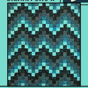 May include: A quilt pattern called "Sierra Snow" by Villa Rosa Designs. The quilt features a black and blue patchwork design with a white snowflake border.
