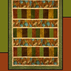 May include: A quilted wall hanging with the text "Cinnamon Stix" at the top. The quilt features vertical stripes in shades of brown, green, and gold, with leaf patterns. The design is by Heidi Cook for Villa Rosa Designs.