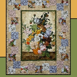 May include: A floral quilt with a central image of a flower arrangement in a vase. The quilt features a beige background with a green border and floral squares. The text "Quilters Palette" and "Molly Cook for Villa Rosa Designs" are visible.