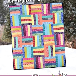 May include: A colorful quilt pattern called "Basket Case" designed by Running Doe Quilts for Villa Rosa Designs. The quilt is made with strips of fabric in various colors and patterns, including yellow, blue, green, pink, and red.