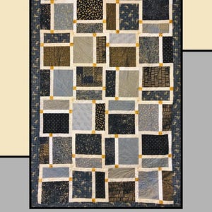May include: A patchwork quilt in shades of blue, grey, and brown. The quilt has a grid pattern with various fabric designs. The text "Chef's Special" is at the top, and "Heidi Cook for Villa Rosa Designs" is at the bottom. A decorative item.