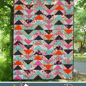 May include: A colorful quilt with a geometric pattern of triangles in shades of pink, orange, black, and teal. The quilt is hanging outdoors, with the text "Flock Together" at the top. The Running Doe Quilts logo is at the bottom.