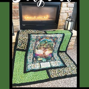 May include: A colorful quilt with a tree of life design, set against a fireplace. The quilt features a central image of a tree with vibrant leaves and a detailed border. The word "Storyteller" is at the top.