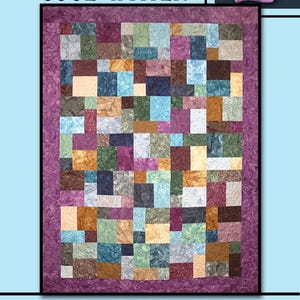 May include: A patchwork quilt with the words "COOL WATER" at the top. The quilt features a variety of square and rectangular fabric pieces in shades of blue, green, purple, and brown. A purple rose is in the upper right corner. The words "Villa Rosa Designs" are at the bottom.