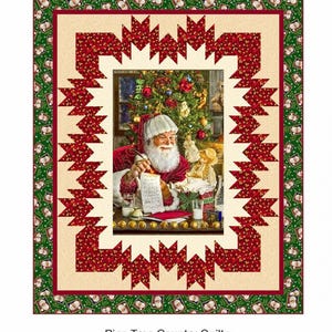 May include: A red and green Christmas quilt featuring a picture of Santa Claus writing a list in front of a Christmas tree. The quilt is bordered by small Santa Claus faces. The text "Santa's List" is at the top of the quilt. The text "Pine Tree Country Quilts" is at the bottom of the quilt, along with the company's address and website.