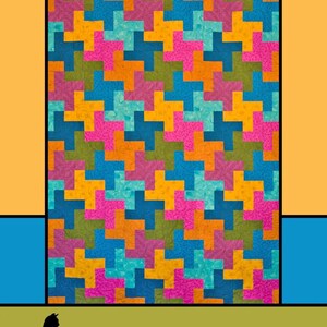 May include: A colorful quilt with a geometric pattern in shades of blue, pink, orange, and green. The text "Positive Sign" is at the top, with "Melissa Milligan for Villa Rosa Designs" at the bottom.