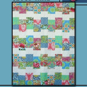 May include: A quilt pattern called "Cloud Nine" by Villa Rosa Designs. The quilt is made with a patchwork of colorful fabrics in shades of pink, blue, green, and white. The quilt is made in a staggered pattern with a white background.