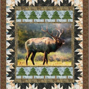 May include: A quilt pattern featuring a brown and black border with a repeating pattern of triangles. The center of the quilt features a photograph of an elk standing in a forest with a mountain in the background. The elk is a silhouette with the forest and mountain visible through its body. The quilt is surrounded by a border of green and white trees.