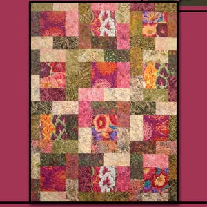 May include: A patchwork quilt with the word "INTRIGUE" at the top. The quilt features squares of floral and abstract patterns in shades of pink, orange, green, and brown. A pink rose is in the upper right corner. The words "Villa Rosa Designs" are at the bottom.