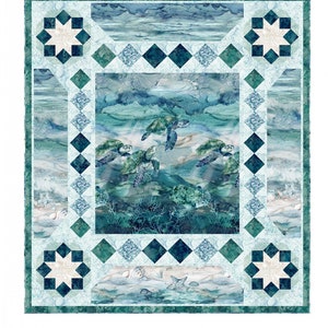 May include: A quilt pattern featuring a sea turtle design with a blue, green, and white color scheme. The pattern is called "Sea Travelers" and is available from Pine Tree Country Quilts. The text "PTN3252" is in the top left corner of the image.