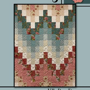 May include: A quilt pattern called "Elsie May" by Villa Rosa Designs. The quilt features a geometric pattern of squares in shades of pink, red, blue, and white. The quilt is made with floral fabric.