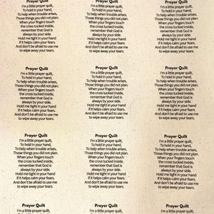 May include: A cream-colored fabric sheet featuring a repeating grid of black printed text titled Prayer Quilt. The poem reads: I'm a little prayer quilt, To hold in your hand, To help when trouble arises, Those things you did not plan.