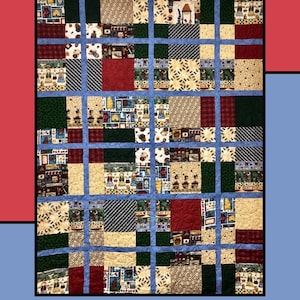 Op de afbeelding: Een patchworkquilt met een blauw rasterpatroon, met vierkanten van verschillende patronen in rood, groen, crème en zwart. De quilt heeft bovenaan de tekst "Slice & Dice" en onderaan "Molly Cook for Villa Rosa Designs".