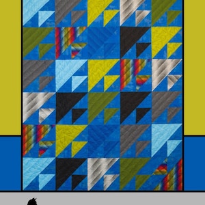 May include: A colorful quilt with a geometric design of triangles in shades of blue, black, green, yellow, and gray. The text "Be Unique" is at the top, with "Melissa Milligan for Villa Rosa Designs" at the bottom.