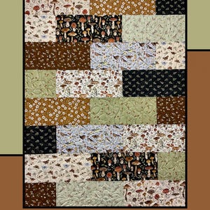 May include: A quilt pattern called "Biscotti" by Heidi Cook for Villa Rosa Designs. The quilt features a patchwork design with various fabrics featuring mushrooms, birds, and floral patterns in shades of brown, green, black, and white.