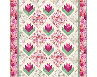 May include: A quilt with a floral pattern in shades of pink and white. The quilt is made up of squares with a tulip design in shades of green and pink. The quilt is surrounded by a border of pink roses.