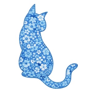 May include: A blue cat-shaped applique with a floral pattern in shades of blue and white. The cat is sitting with its tail curled. The applique has a stitched border and is set against a white background.