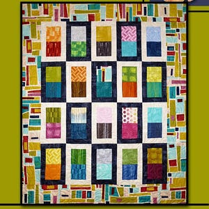 May include: A quilt pattern called "About Face" by Villa Rosa Designs. The quilt features a grid of 18 colorful squares, each with a different pattern. The squares are surrounded by a border of colorful geometric shapes. The quilt is made with a variety of fabrics, including solids, prints, and textures. The quilt is a great example of modern quilting.