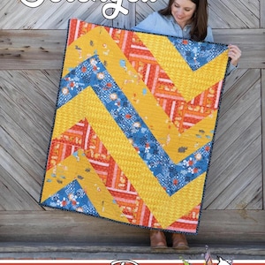 Könnte beinhalten: Ein farbenfroher Quilt mit einem Zickzackmuster in Gelb, Blau und Orange. Der Quilt trägt oben das Wort "Serengeti" und unten das Logo Running Doe Quilts. Der Quilt wird von einer Person gehalten.