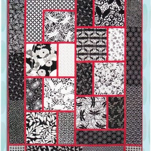 May include: A quilt pattern featuring a variety of black and white fabric designs. The quilt is made up of squares and rectangles, and the fabric designs include floral patterns, geometric patterns, and abstract patterns. The quilt is called "The Big Block Quilt" and is designed by Minay Sirois.