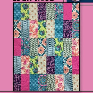 May include: A patchwork quilt with the text "EDEN ROSE" at the top and "Villa Rosa Designs" at the bottom. The quilt features a variety of floral and patterned fabrics in shades of pink, blue, green, and purple. A pink rose is in the upper right corner.