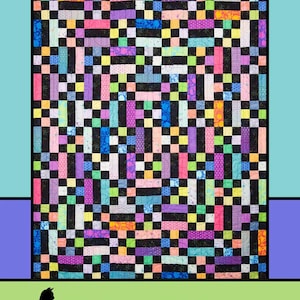 May include: A colorful quilt with a geometric pattern. The quilt features a mix of vibrant colors including pink, purple, green, and yellow, arranged in a block design. The word "Transcendent" is at the top, with "Melissa Milligan for Villa Rosa Designs" at the bottom.