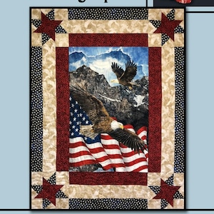 May include: A quilt pattern featuring a red, white, and blue American flag with two bald eagles flying over a mountain range. The quilt is framed with a border of red, white, and blue stars. The title "Daring Spirit" and the text "Villa Rosa Designs" are included in the image.