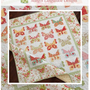 May include: A handmade quilt featuring a butterfly pattern. The quilt showcases a white background with colorful butterfly appliqués in red, orange, and green. The border has a floral design with a green gingham trim.