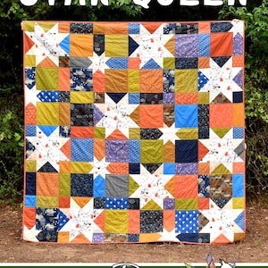 May include: A colorful quilt with a patchwork design featuring star patterns and square blocks in shades of orange, blue, green, and purple. The text "STAR QUEEN" is at the top. The quilt is made by Running Doe Quilts for Villa Rosa Designs.
