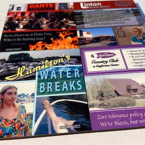 May include: A set of six colourful coasters featuring various images and text. The coasters depict a woman in a floral shirt, a boat on a lake, a building with a sign that reads "Hamilton's Water Breaks", a building with a sign that reads "Choristers Country Club & Conference Centre", a building with a sign that reads "Linton Travel House", and a building with a sign that reads "Dante Fireplaces".