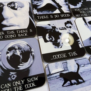 May include: Set of nine black and white square coasters with different images and text from the movie The Matrix. The text on the coasters includes "There is no spoon", "After this, there is no going back", "...dodge this", "You can't be dead. You can't be because I love you", and "I can only show you the door."