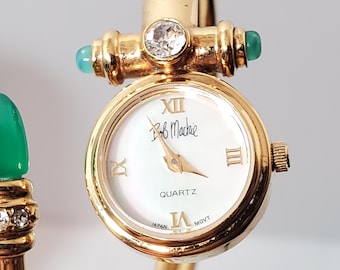 Reloj de cuarzo vintage para mujer Bob Mackie con baño de oro y esfera de nácar.