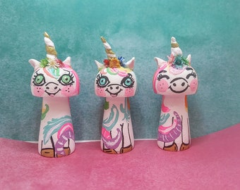Muñecas de clavija de unicornio