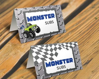 May include: Two printable food tent cards with a monster truck theme. The cards are gray with a checkered flag and a monster truck graphic. The text on the cards reads "Monster Subs".