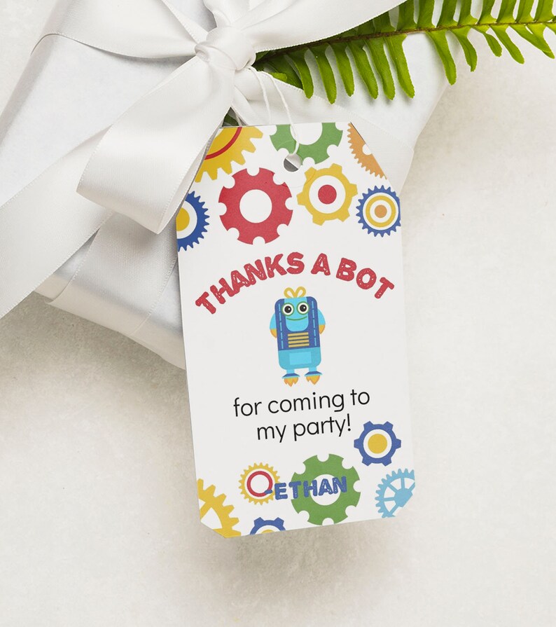 May include: A white thank you tag with a blue robot illustration and the text "Thanks a bot for coming to my party!" with the name Ethan at the bottom. The tag is decorated with colorful gears.