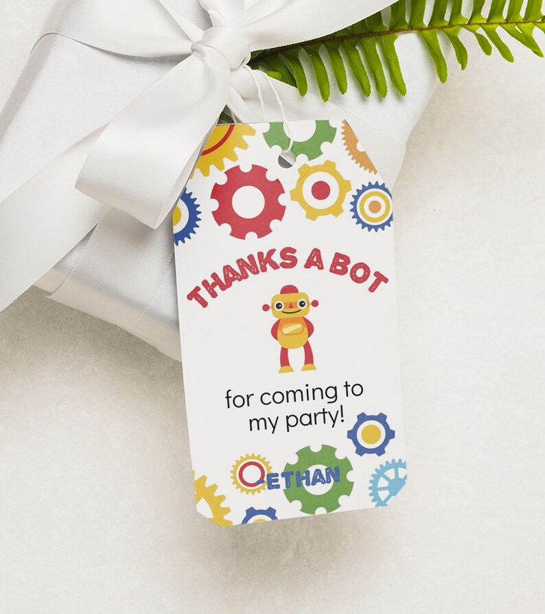May include: A white thank you tag with a colorful robot and gears design. The text reads "Thanks a bot for coming to my party! Ethan".