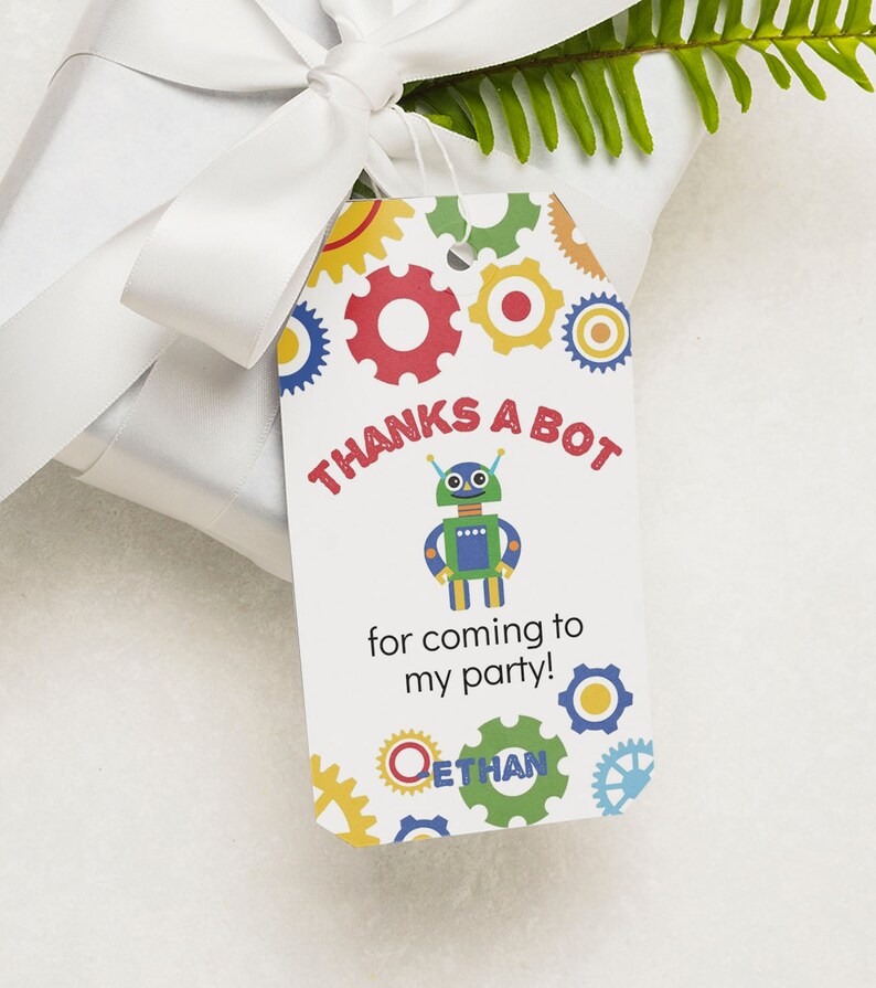 May include: A white thank you tag with a robot and gears. The text on the tag reads "Thanks a Bot for coming to my party! Ethan".