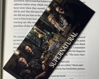 May include: A close-up of a book with the title "Supernatural" on the cover. The book is open to a page with text about a character in the book. The text reads, "I remember psych 101 diagnose, "The main character had said. "At or a robot," Mark said. "I think he has borderline personality disorder."