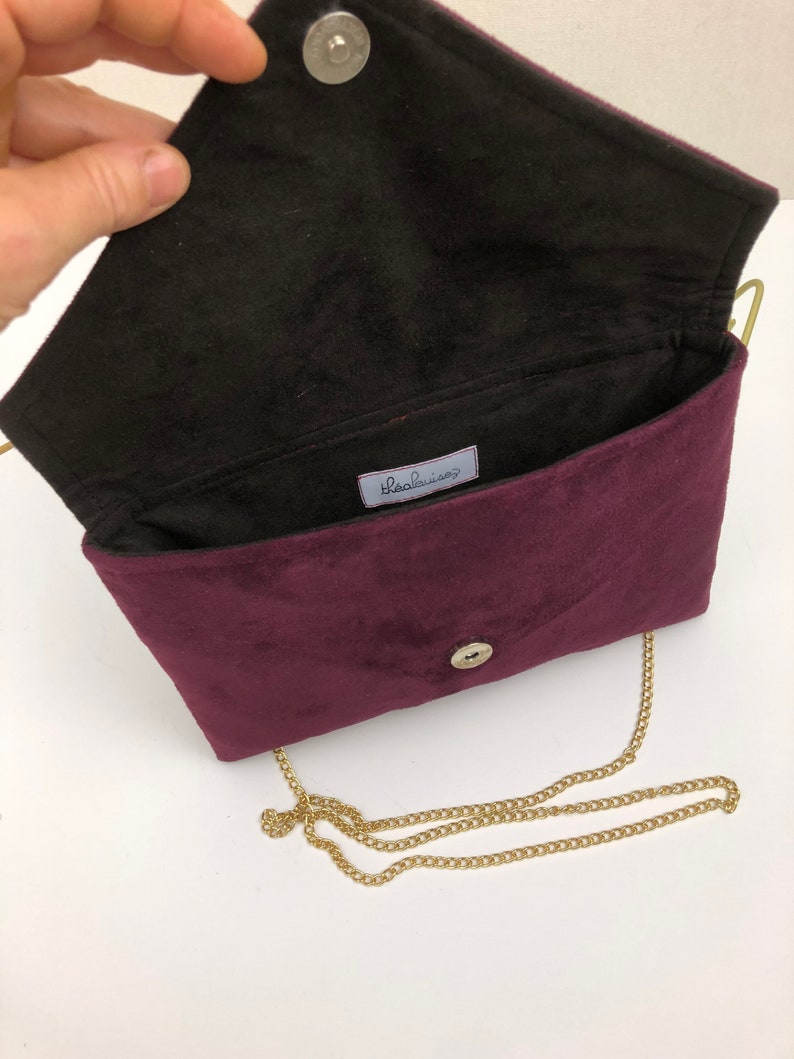 Plum burgundy envelope clutch ideal for storing the essentials for an evening image 2