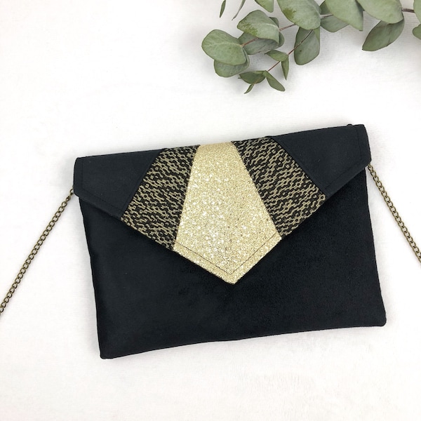 Pochette da sera nera e oro ideale per accessoriare un outfit