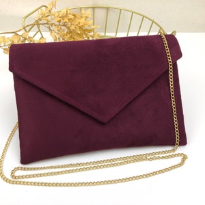 Plum burgundy envelope clutch ideal for storing the essentials for an evening image 1