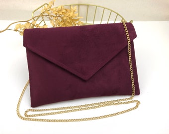 Plum burgundy envelope clutch ideal for storing the essentials for an evening