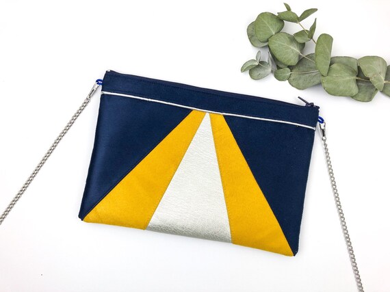 navy and mustard clutch bag