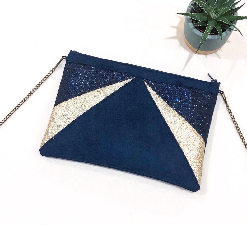 navy glitter clutch bag