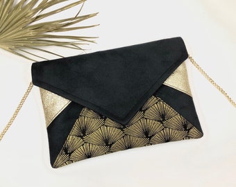 Pochette noire et dorée paillettes idéale pour une soirée ou en cadeau de Noël