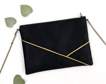 Women's black and gold clutch bag perfect for an evening or a ceremony