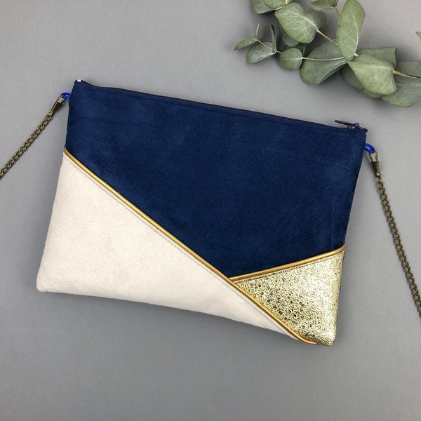 Marineblaue, beige und goldene Clutch, perfekt als Accessoire für ein Outfit